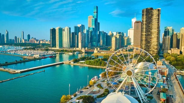 Navy Pier, its Ferris wheel and the Chicago skyline from above on a sunny day